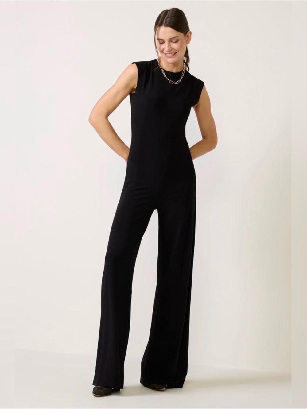 Black Sleeveless Babydoll Jumpsuit with Wide-Leg by Kamalikulture X Norma Kamali